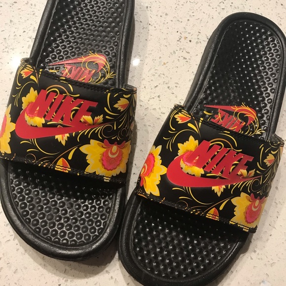 red black and gold nike slides